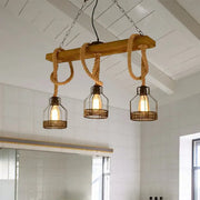 Industrial wood and rope caged restaurant island lighting with black pendant chandelier featuring edison bulbs in wire cages