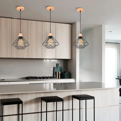 Three black metal cage industrial wood ceiling chandelier pendant lights with wooden caps above kitchen island decorbites industrial wood
