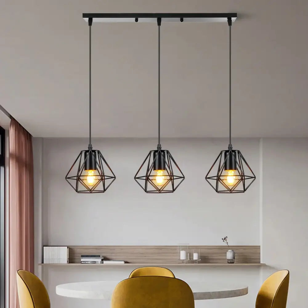 Three black geometric industrial wood pendant lights with exposed bulbs hang from a ceiling bar for dining room decorbites industrial wood pendant
