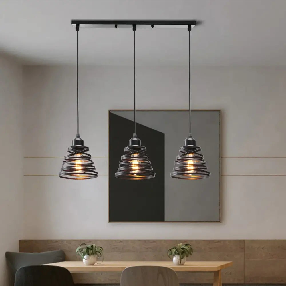 Three black wrought iron decorbites industrial wood pendant lights with spiral wire shades for dining room decor