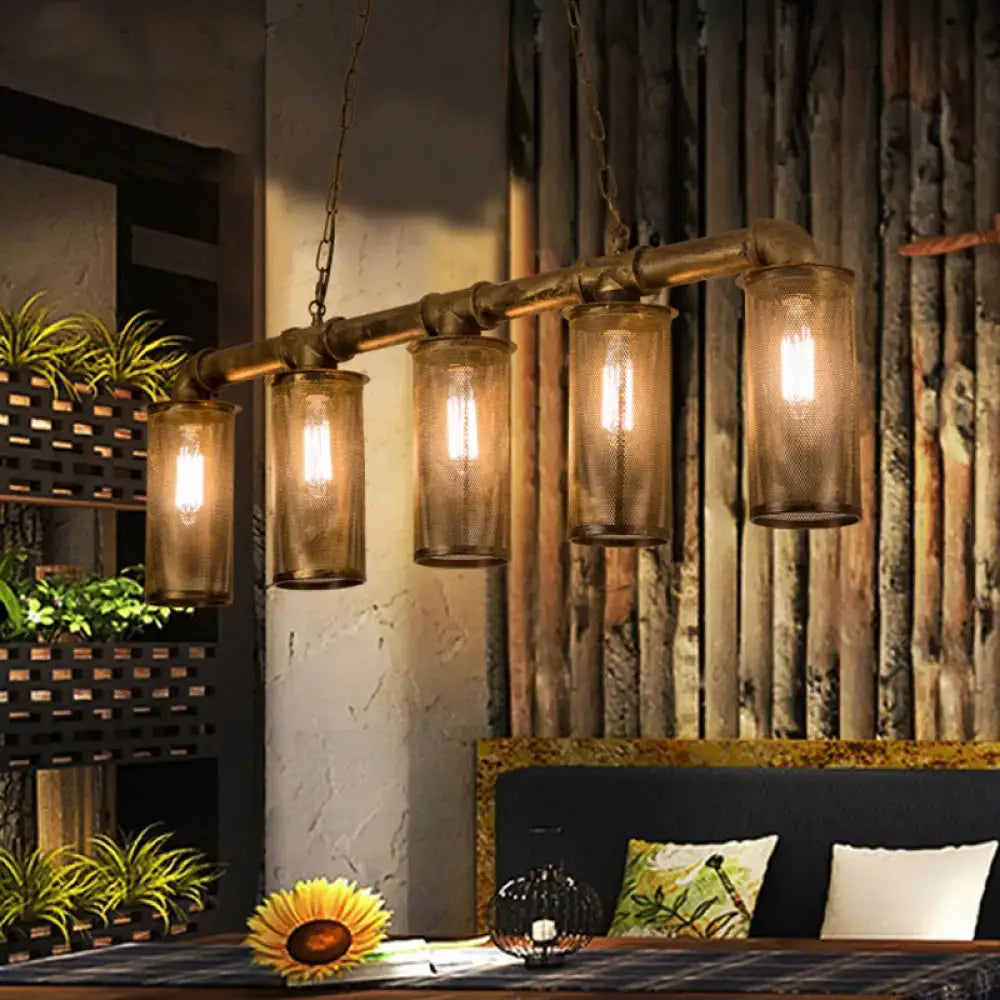 Industrial-style wrought iron brass pipe chandelier with five amber glass lanterns 110v-120v bulb base for kitchen island
