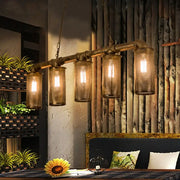 Industrial-style wrought iron brass pipe chandelier with five amber glass lanterns 110v-120v bulb base for kitchen island