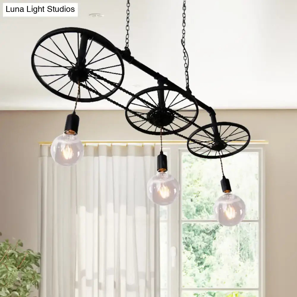 DecorBites vintage industrial black island light with wrought iron wheel design and three exposed bulb fixtures