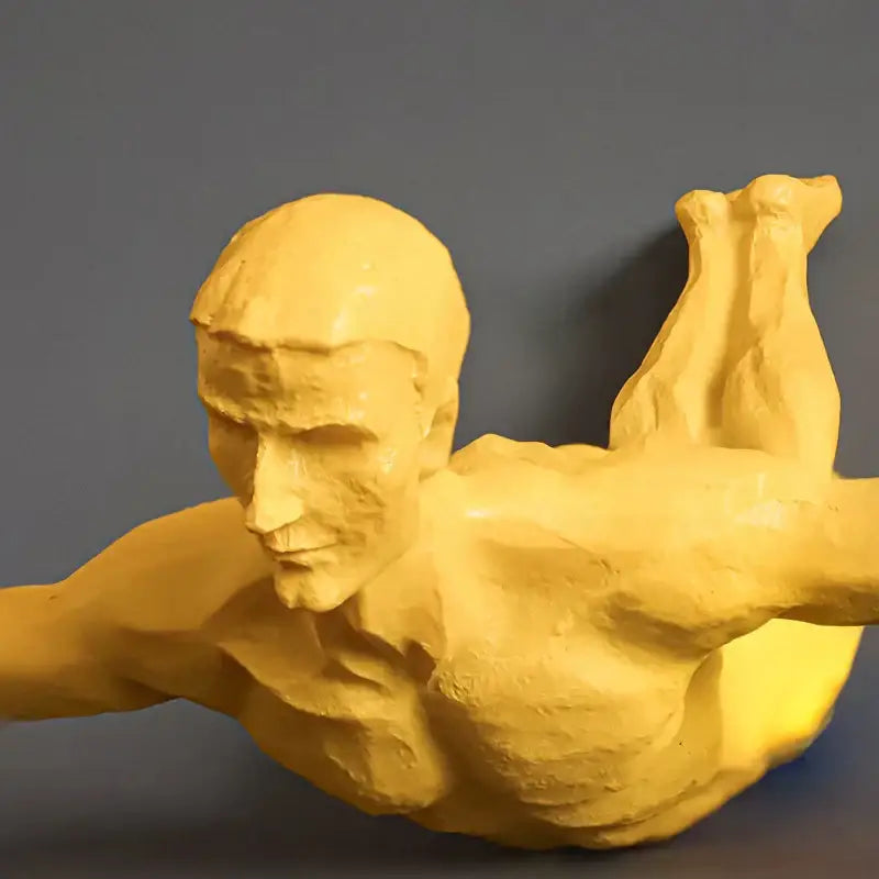Golden resin muscular man mid-dive industrial yellow bungee jumper wall sculpture decorbites bungee jumper decor