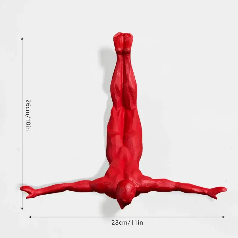 Vibrant red glossy-finished human figure decorbites bungee jumper wall sculpture in dynamic upside-down pose for living room decor