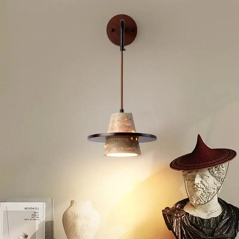 Industrial yellow travertine wall lamp with pull chain switch featuring concrete shade and black metal accents for bedroom use