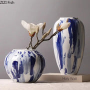 Two ceramic vases with ink style blue and white brushstroke patterns for living room decor featuring ink style flowers