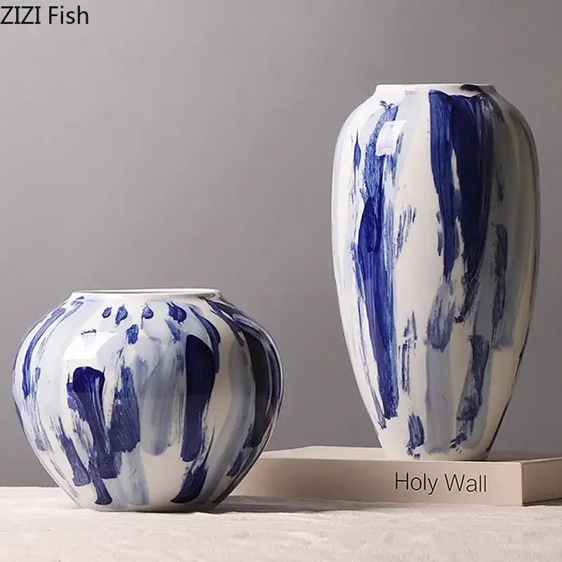Two blue and white ceramic vases with ink style abstract brushstroke patterns for living room decor