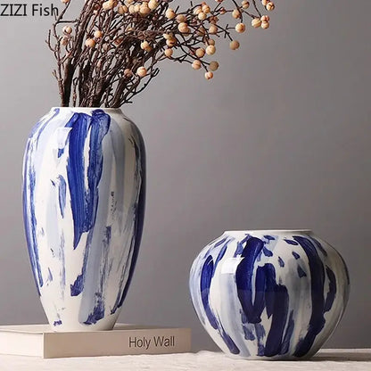 Two ceramic vases with bold blue and white ink style brushstroke patterns for living room decor