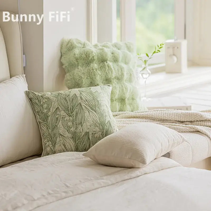 A soft sage green ins wind matcha faux fur throw pillow with a textured botanical leaf pattern for living room decor