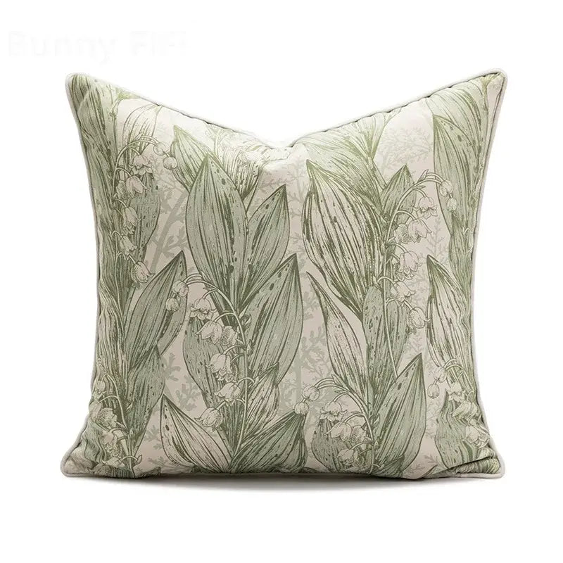 Square ins wind matcha green faux fur throw pillow with delicate lily-of-the-valley botanical print on off-white background