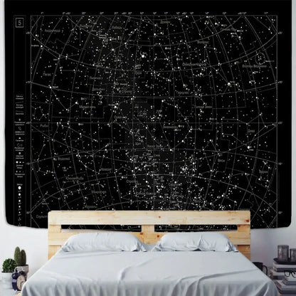 Black celestial tapestry with white sky map constellations hanging above wooden bed frame for decorbites interstellar sky decor