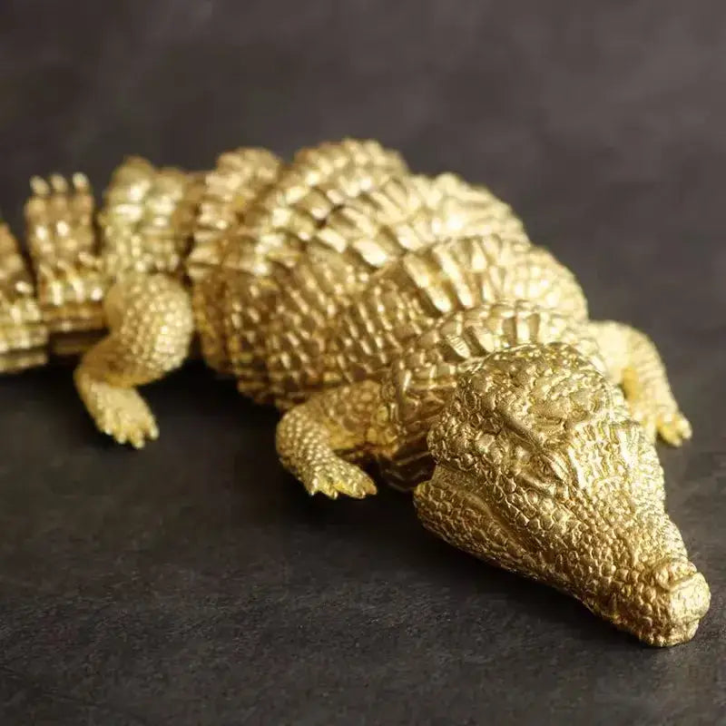 Intricate decorbites brass crocodile sculpture with detailed textured scales in a lifelike pose for living room decor