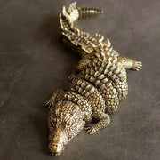 Intricate decorbites brass crocodile sculpture with bronze color and textured scales for living room decor accessory