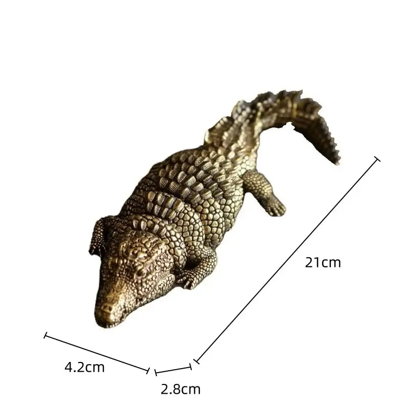 Bronze-colored brass crocodile sculpture with detailed scales and textured skin by decorbites for living room decor