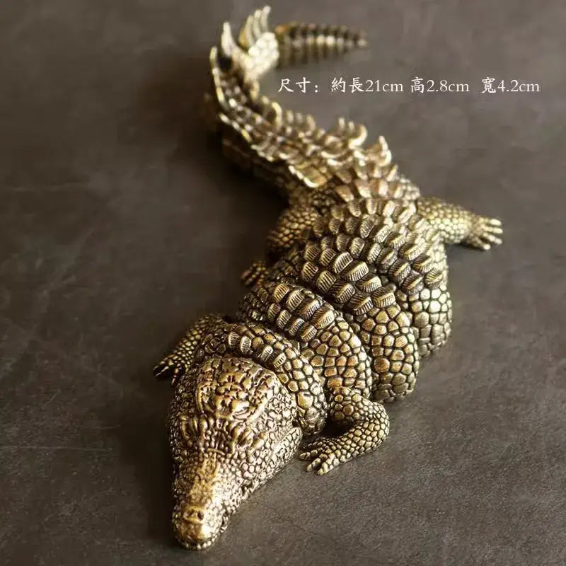 Intricate decorbites brass crocodile sculpture with bronze textured scales and spiked tail for living room decor