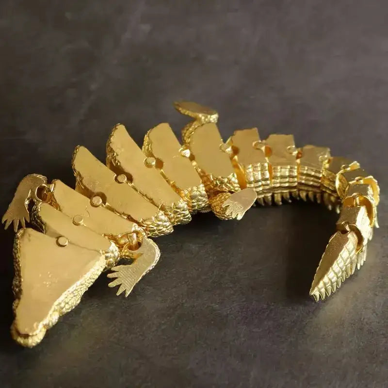 Gold-colored articulated brass crocodile sculpture bracelet with textured scales for decorbites brass living room decor
