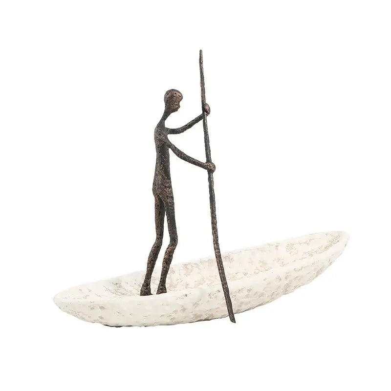 Bronze-colored minimalist human figure on textured boat with pole metal horse decoration for living room sculpture