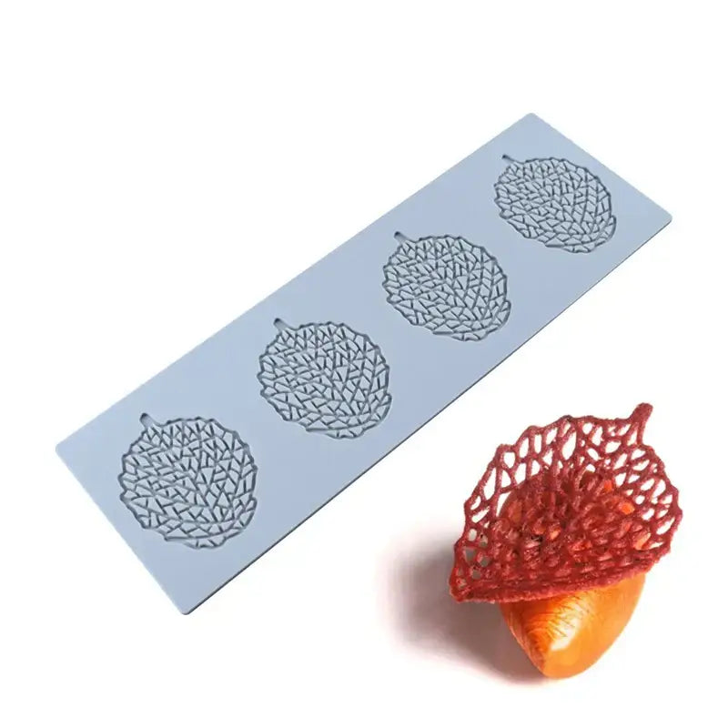 Light blue silicone mold with four intricate acorn-shaped cavities from decorbites coral branch leaf kitchen tool