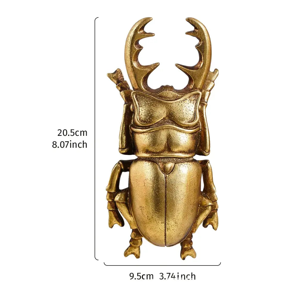 Intricate golden beetle resin handicraft with detailed antler-like horns and segmented body for wall decor