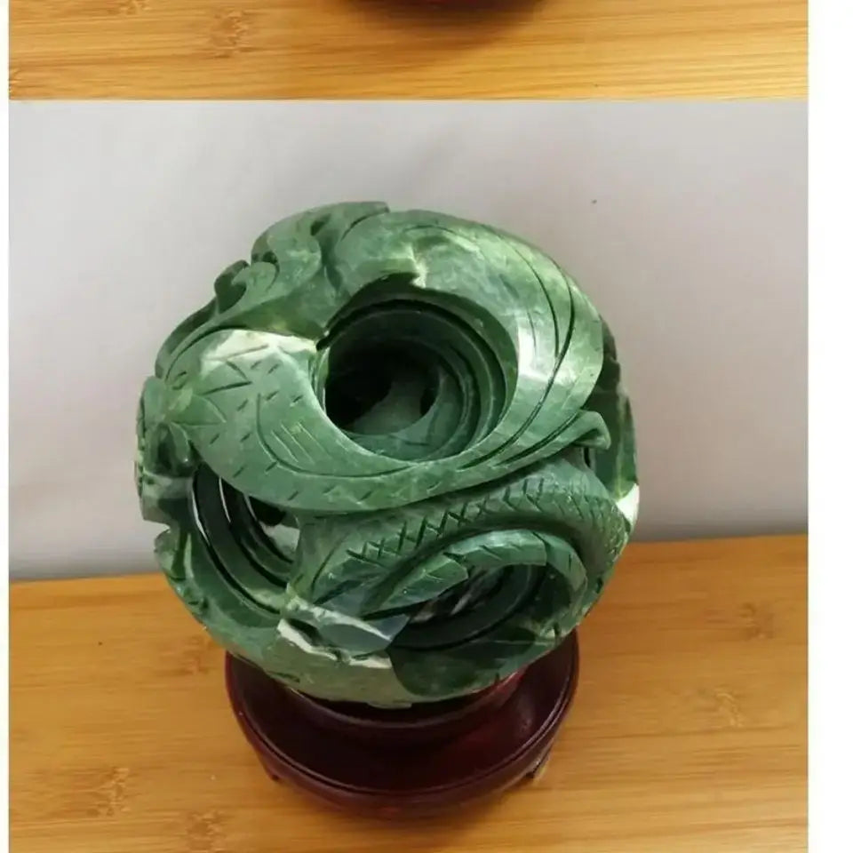 Intricate green jade stone dragon sculpture coiled with detailed scales for dragon phoenix living room decor