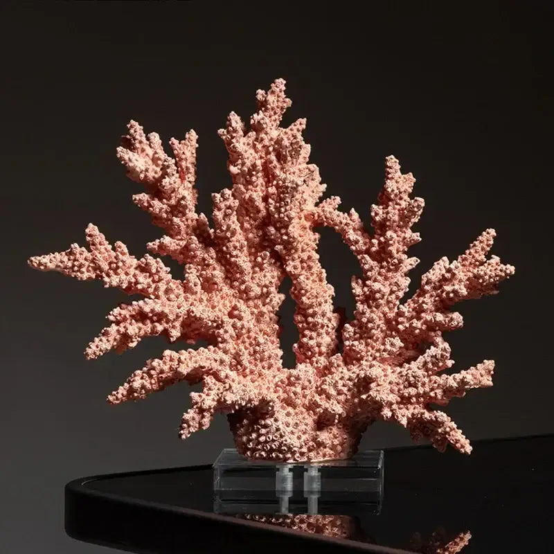 A delicate pink coral resin ornament with intricate branching textures and a glossy finish for living room decor
