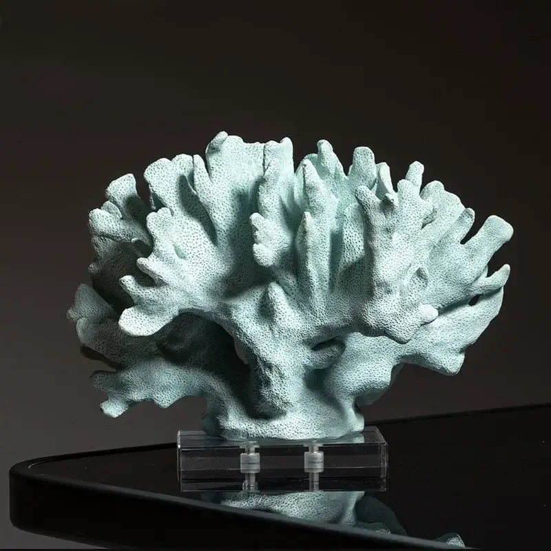 A light teal textured coral resin ornament with a porous branching structure for living room decor