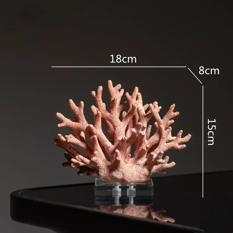 Intricate coral resin ornaments in peach matte finish mounted on clear acrylic base for living room decor