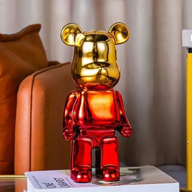 Glossy two-toned bearbrick piggy bank with a golden head and red body for cabinet sculpture decor and bear tv cabinet