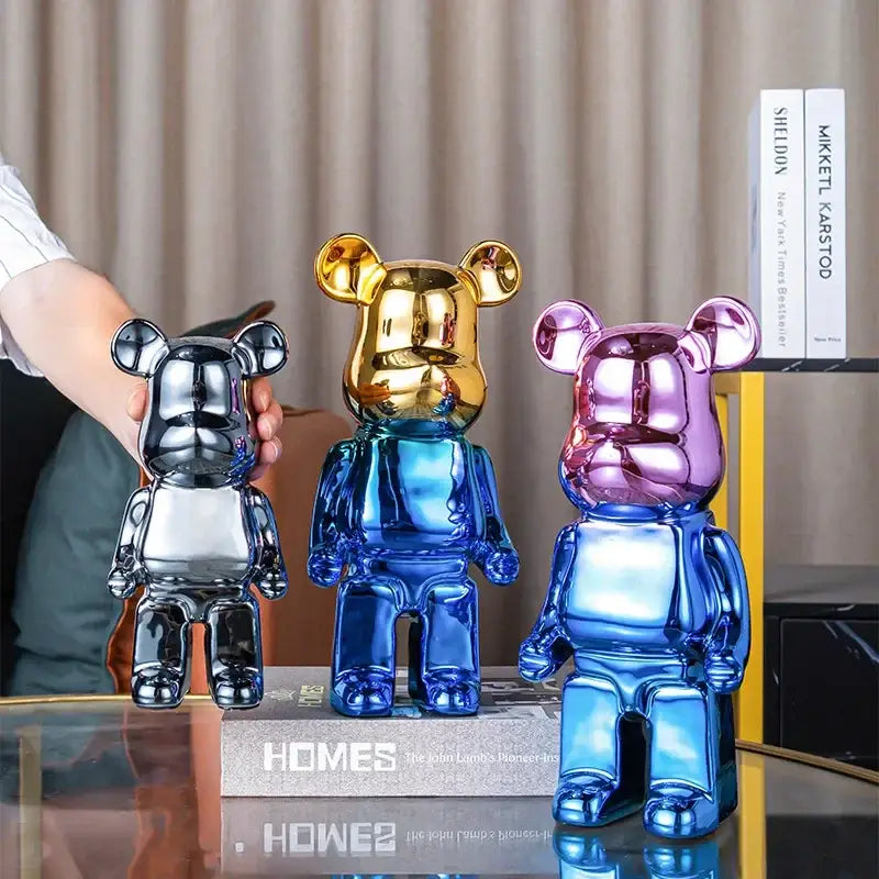 Three glossy metallic bear piggy banks in black gold and purple-blue hues for bear tv cabinet sculpture decor