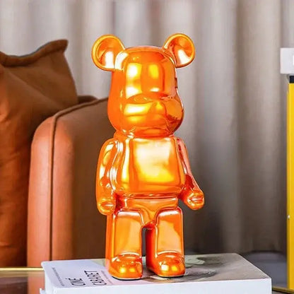 Orange translucent bear piggy bank with glossy finish as iridescent cabinet sculpture decor for living room or tv cabinet