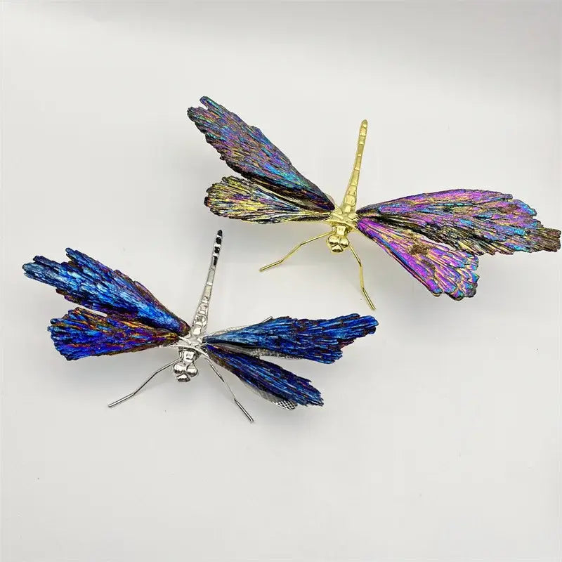 Two iridescent crystal dragonfly decorative figurines with gold and silver bodies and blue purple wings for bedroom decor