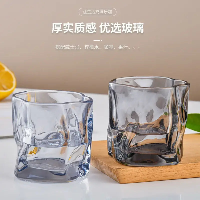 Two clear textured glass cups with modern faceted design from the decorbites iceberg glass tumbler set
