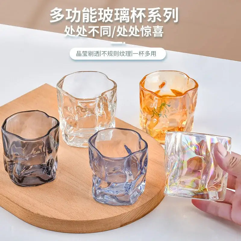 Set of four decorbites iceberg glass cups with iridescent floral patterns in clear amber and smoky gray textured glass