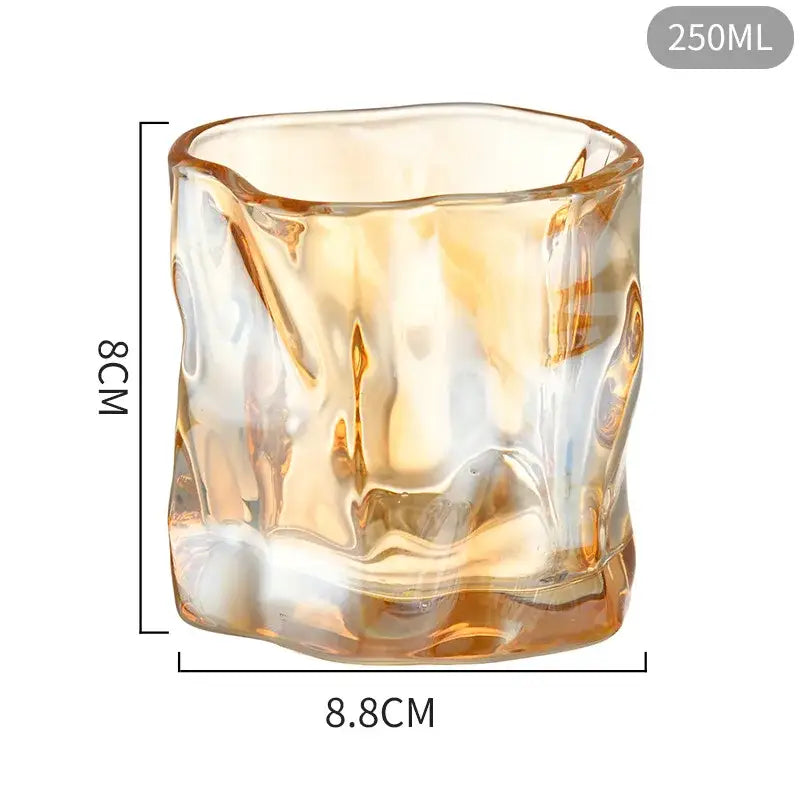 A 250ml amber-colored textured glass cup with wavy surface from decorbites iceberg glass set for dining room use