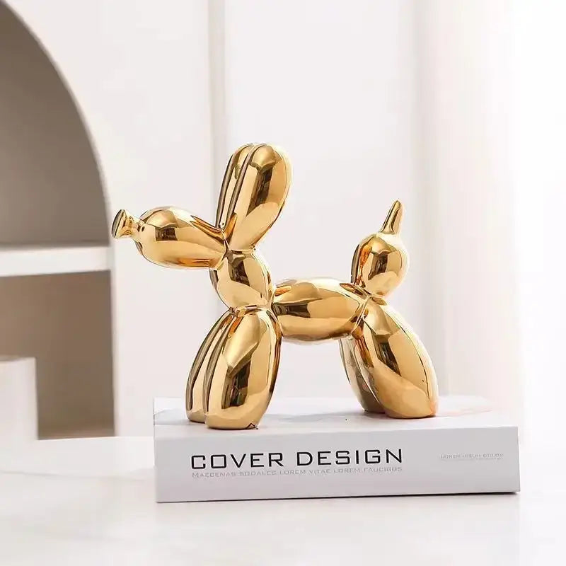 Shiny gold balloon dog ceramic sculpture with iridescent glossy surface for sophisticated living room decor