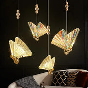 Iridescent gold butterfly pendant light with rainbow wings and metallic accents perfect for bedroom or living room decorbites butterfly pendant lights