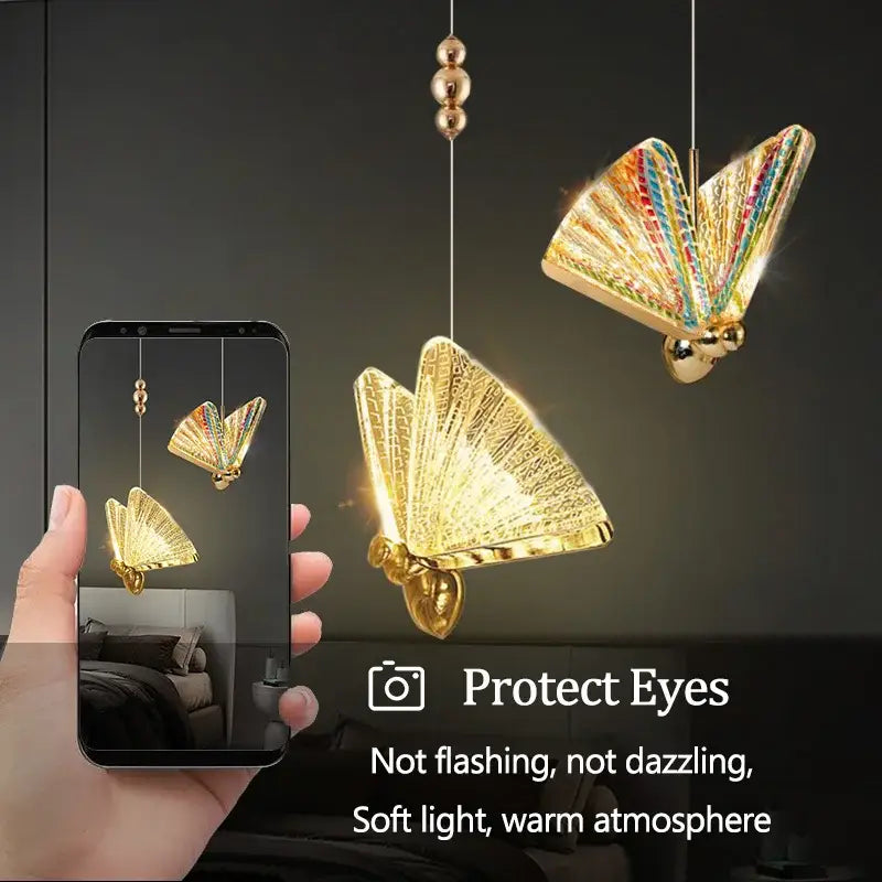 Iridescent gold butterfly pendant lights with rainbow-colored wings and metallic bodies for living and dining rooms