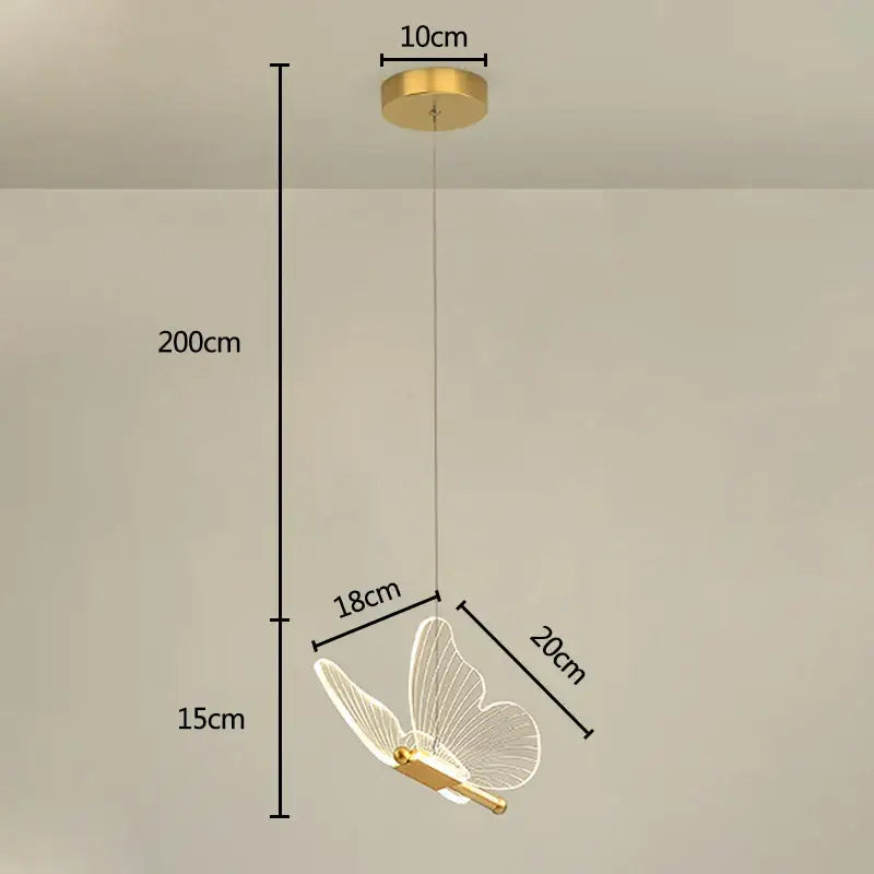 Iridescent gold butterfly pendant light with translucent wireframe wings and sleek metallic body for living room