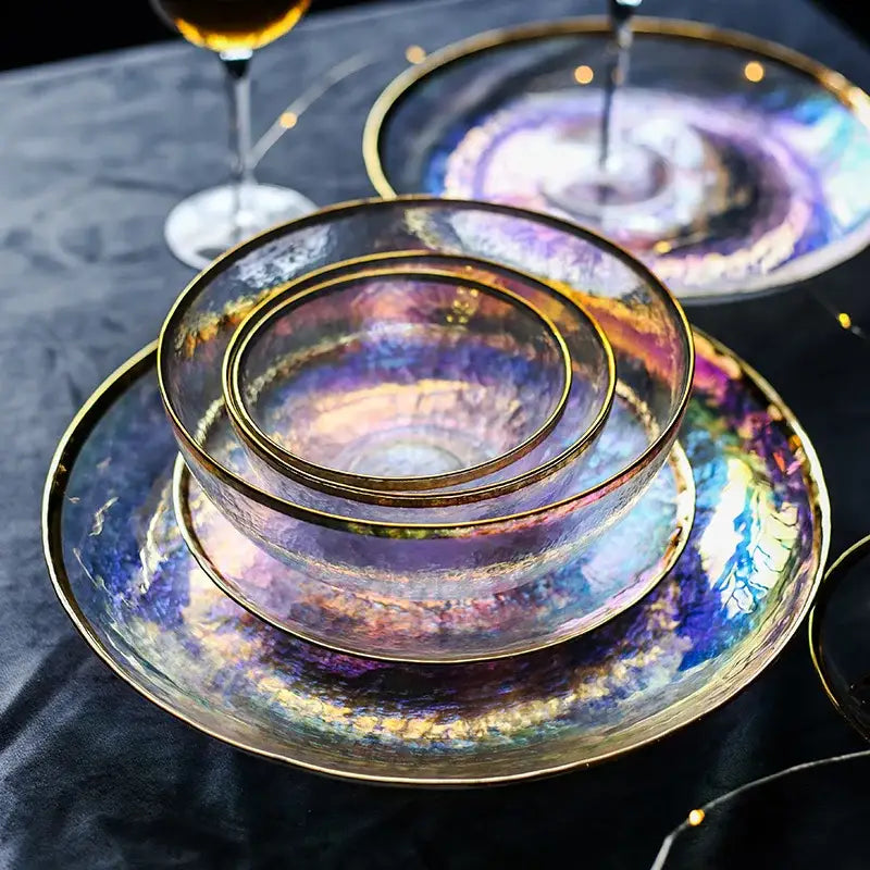 Iridescent glass salad bowl with gold rims featuring swirling purple blue and pink patterns for dining tableware