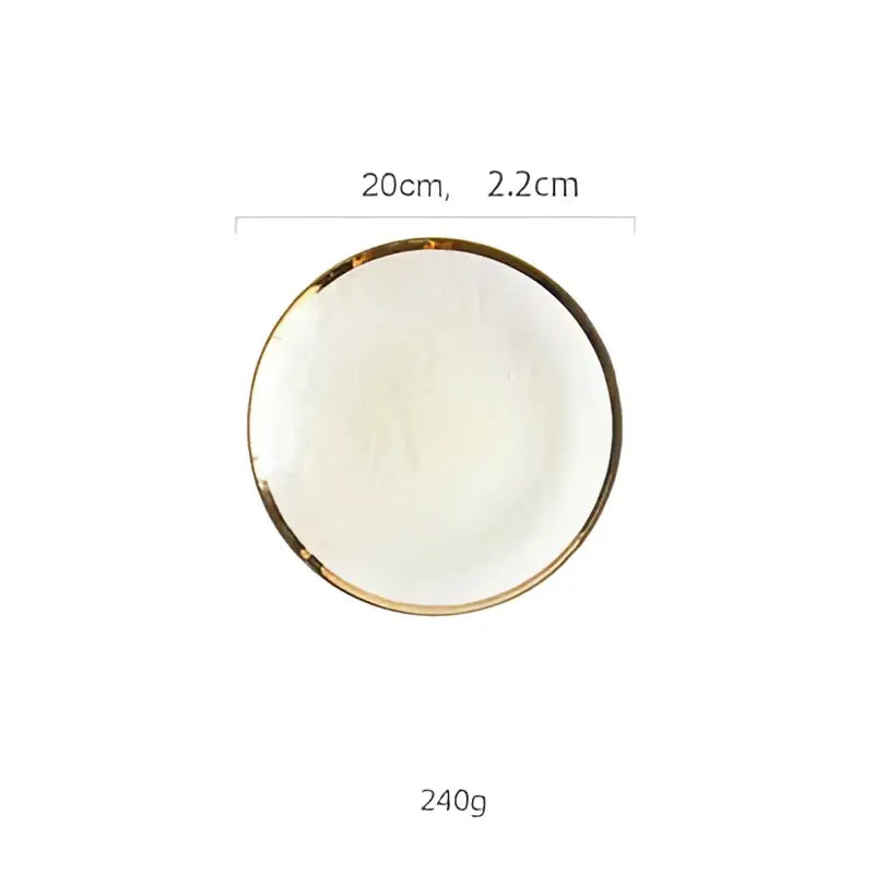A round white ceramic plate with a thin gold rim for use with a glass salad bowl on the dining room table