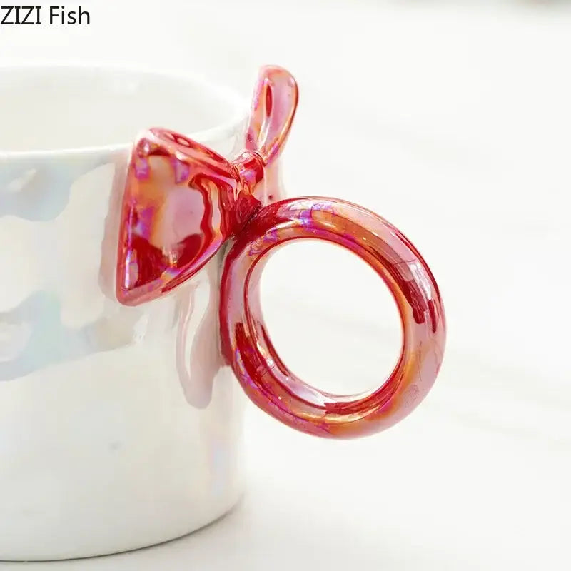 Iridescent heart bowknot glazed coffee mug with a glossy translucent red bowknot glazed handle for dining room tea use