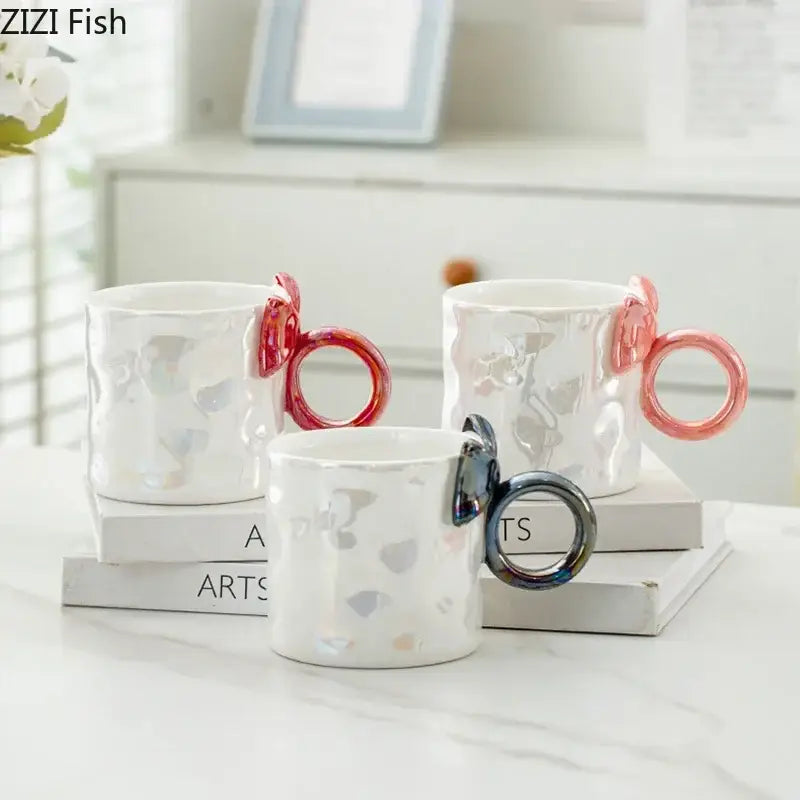 Three white ceramic coffee mugs with iridescent heart patterns and decorbites bowknot glazed colorful handles