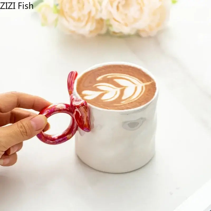 White ceramic coffee mug with bowknot glazed vibrant red and pink marbled fish handle by decorbites bowknot glazed
