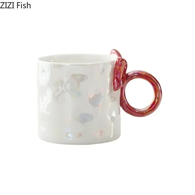 Iridescent heart bowknot glazed coffee mug with white ceramic, fish embossments, and pink translucent fish tail handle for tea