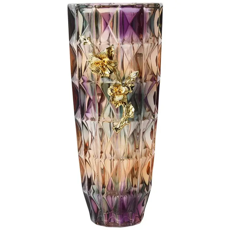 A tall faceted crystal glass vase with purple and amber gradient and three golden floral embellishments