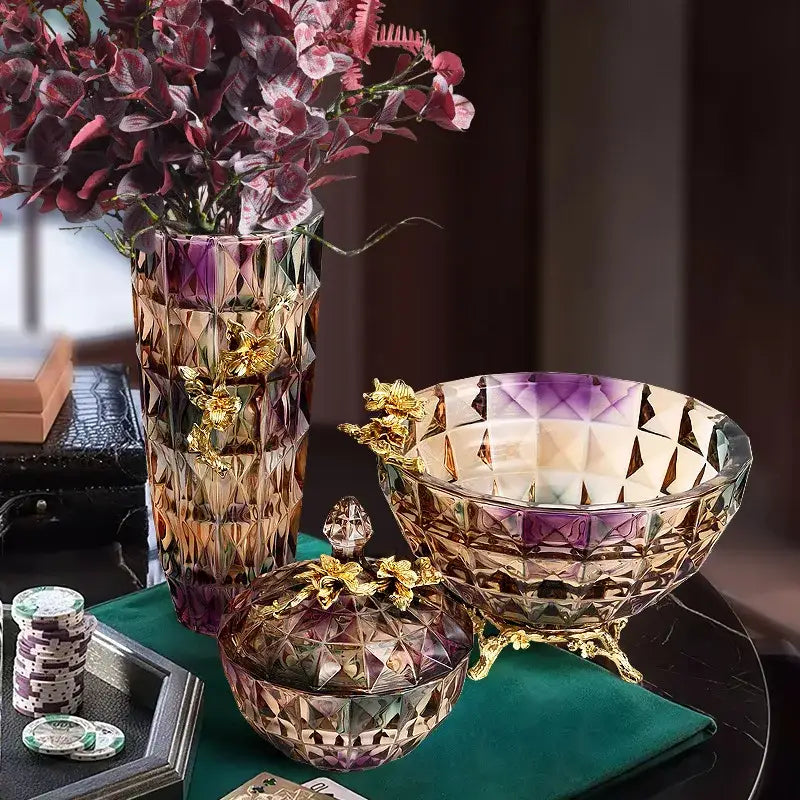 Iridescent iris crystal glass dessert bowl with gold leaf floral accents and geometric faceting on ornate feet