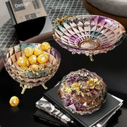 Iris crystal glass dessert bowl with gold leaf accents and three ornate feet for elegant dining room use