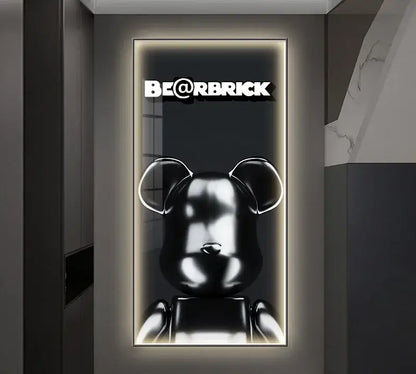Black glossy bearbrick figure in metal frame illuminated as led wall lamp for bedroom decor