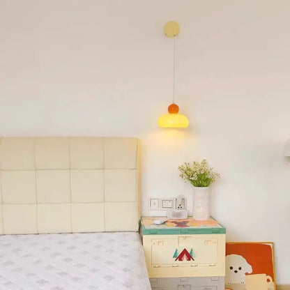 A cheerful yellow and orange dome-shaped pendant lamp with slender cord fitting decorbites iron nordic led wall light design